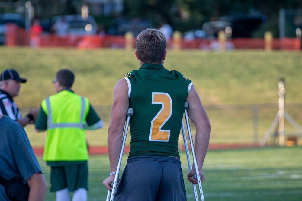 Ben Walker on crutches